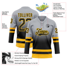 Laden Sie das Bild in den Galerie-Viewer, Custom Gray Black-Gold Fade Fashion Hockey Lace Neck Jersey