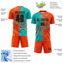 Laden Sie das Bild in den Galerie-Viewer, Custom Graffiti Pattern Black Aqua-Orange Scratch Sublimation Soccer Uniform Jersey