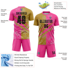 Laden Sie das Bild in den Galerie-Viewer, Custom Graffiti Pattern Black Old Gold-Pink Scratch Sublimation Soccer Uniform Jersey