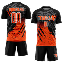 Laden Sie das Bild in den Galerie-Viewer, Custom Black Orange-White Gradient Scratch Splash Sublimation Soccer Uniform Jersey