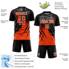 Laden Sie das Bild in den Galerie-Viewer, Custom Black Orange-White Gradient Scratch Splash Sublimation Soccer Uniform Jersey