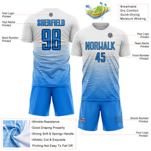Загрузить изображение в средство просмотра галереи, Custom White Powder Blue-Black Gradient Wave Line Sports Sublimation Soccer Uniform Jersey