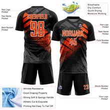 Laden Sie das Bild in den Galerie-Viewer, Custom Black Orange-White Grunge Splatter Brush Stroke Sublimation Soccer Uniform Jersey