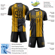 Laden Sie das Bild in den Galerie-Viewer, Custom Black-Gold Brush Stroke Fluid Stripes Sublimation Soccer Uniform Jersey