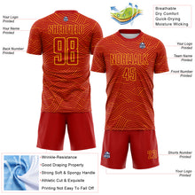 Laden Sie das Bild in den Galerie-Viewer, Custom Red-Gold Abstract Wave Lines Interlocking Sublimation Soccer Uniform Jersey
