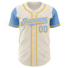 Laden Sie das Bild in den Galerie-Viewer, Custom Cream Light Blue White-Gold Authentic Two Tone Baseball Jersey