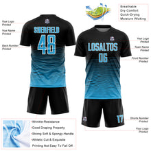 Laden Sie das Bild in den Galerie-Viewer, Custom Black Sky Blue-White Gradient Line Sublimation Soccer Uniform Jersey
