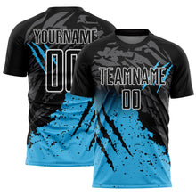 Laden Sie das Bild in den Galerie-Viewer, Custom Black Sky Blue-White Gradient Scratch Splash Sublimation Soccer Uniform Jersey
