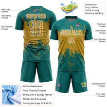 Laden Sie das Bild in den Galerie-Viewer, Custom Teal Old Gold-White Abstract Splatter Grunge Art Sports Sublimation Soccer Uniform Jersey

