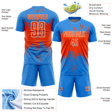 Laden Sie das Bild in den Galerie-Viewer, Custom Powder Blue Orange-White Abstract Splatter Grunge Art Sports Sublimation Soccer Uniform Jersey
