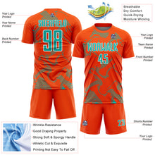 Laden Sie das Bild in den Galerie-Viewer, Custom Orange Aqua-White Curve Lines Sports Sublimation Soccer Uniform Jersey
