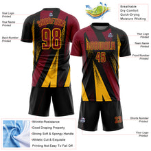 Laden Sie das Bild in den Galerie-Viewer, Custom Black Crimson-Gold Radial Burst Sports Sublimation Soccer Uniform Jersey
