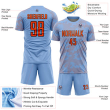 Load image into Gallery viewer, Custom Light Blue Orange-Black Curve Lines Sublimation Soccer Uniform Jersey
