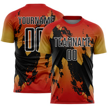 Load image into Gallery viewer, Custom Red Black Old Gold-White Gradient Splash Sublimation Soccer Uniform Jersey
