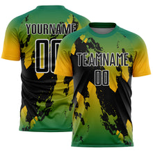Laden Sie das Bild in den Galerie-Viewer, Custom Kelly Green Black Gold-White Gradient Splash Sublimation Soccer Uniform Jersey
