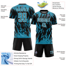 Laden Sie das Bild in den Galerie-Viewer, Custom Black Panther Blue-White Splatter Torn Sharp Brush Stroke Sublimation Soccer Uniform Jersey
