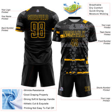 Laden Sie das Bild in den Galerie-Viewer, Custom Black Gold-Gray Abstract Geometric Stripe Fragment Sublimation Soccer Uniform Jersey
