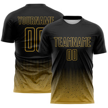 Laden Sie das Bild in den Galerie-Viewer, Custom Black-Old Gold Fade Wave Lines Splatter Sublimation Soccer Uniform Jersey
