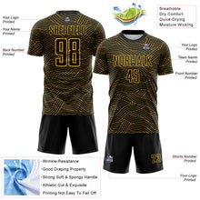 Laden Sie das Bild in den Galerie-Viewer, Custom Black-Gold Abstract Wave Lines Interlocking Sublimation Soccer Uniform Jersey
