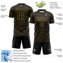 Laden Sie das Bild in den Galerie-Viewer, Custom Black-Old Gold Abstract Wave Lines Interlocking Sublimation Soccer Uniform Jersey
