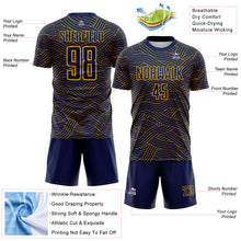Laden Sie das Bild in den Galerie-Viewer, Custom Navy-Gold Abstract Wave Lines Interlocking Sublimation Soccer Uniform Jersey
