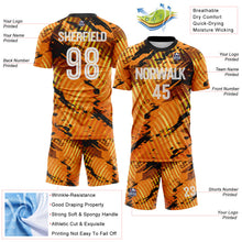 Laden Sie das Bild in den Galerie-Viewer, Custom Gold White-Black Abstract Swirl Wave Grunge Splatter Sublimation Soccer Uniform Jersey
