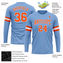 Load image into Gallery viewer, Custom Light Blue Orange-White Long Sleeve Performance T-Shirt
