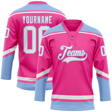 Laden Sie das Bild in den Galerie-Viewer, Custom Pink White-Light Blue Hockey Lace Neck Jersey
