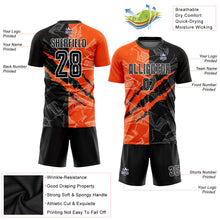 Laden Sie das Bild in den Galerie-Viewer, Custom Graffiti Pattern Black-Orange Scratch Sublimation Soccer Uniform Jersey
