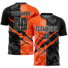 Laden Sie das Bild in den Galerie-Viewer, Custom Graffiti Pattern Black-Orange Scratch Sublimation Soccer Uniform Jersey
