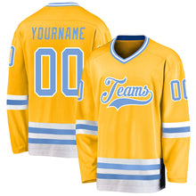 Laden Sie das Bild in den Galerie-Viewer, Custom Gold Light Blue-White Hockey Jersey
